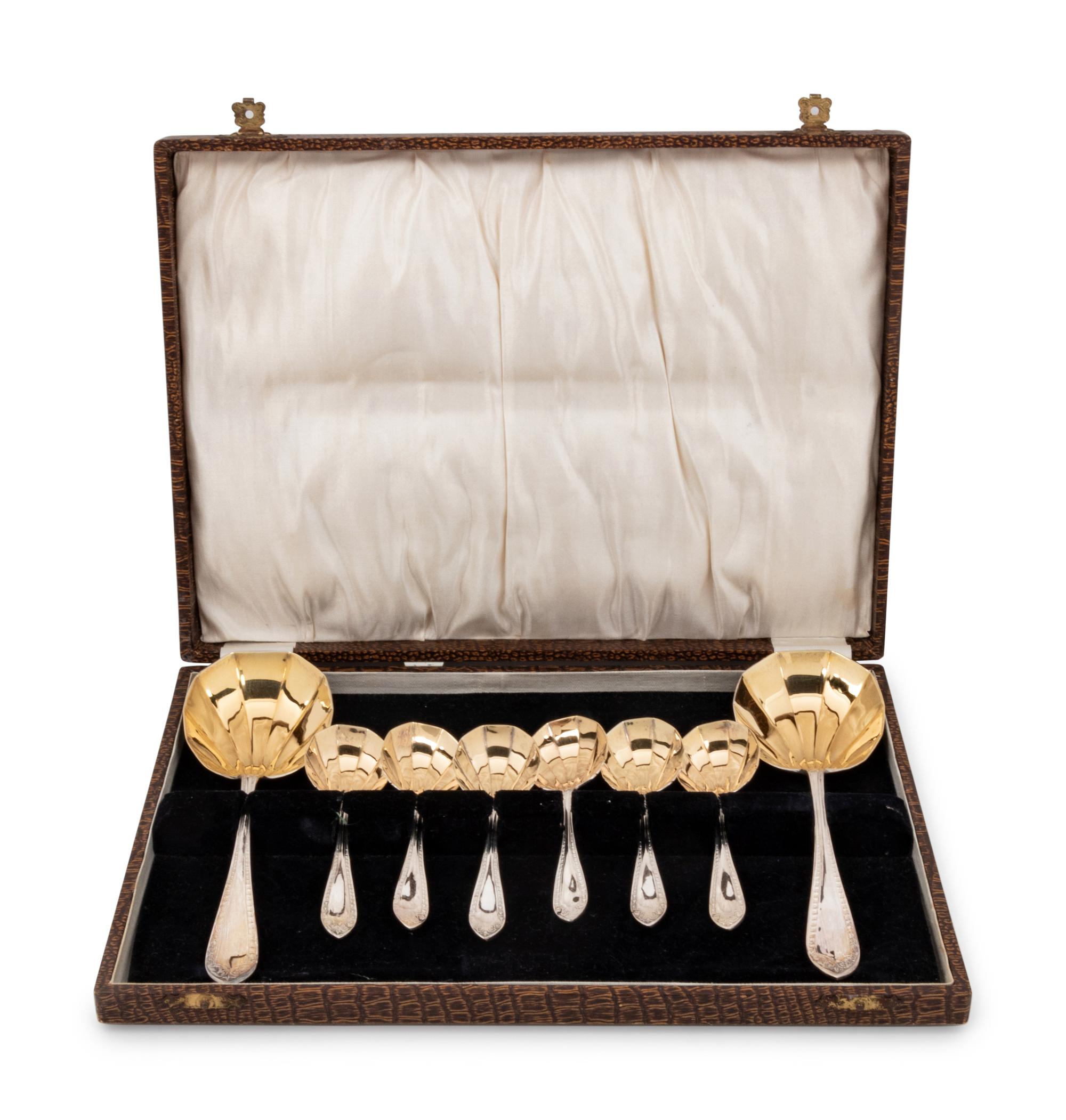 A Cased Set of Parcel Gilt SIlver-Plate Serving Spoons