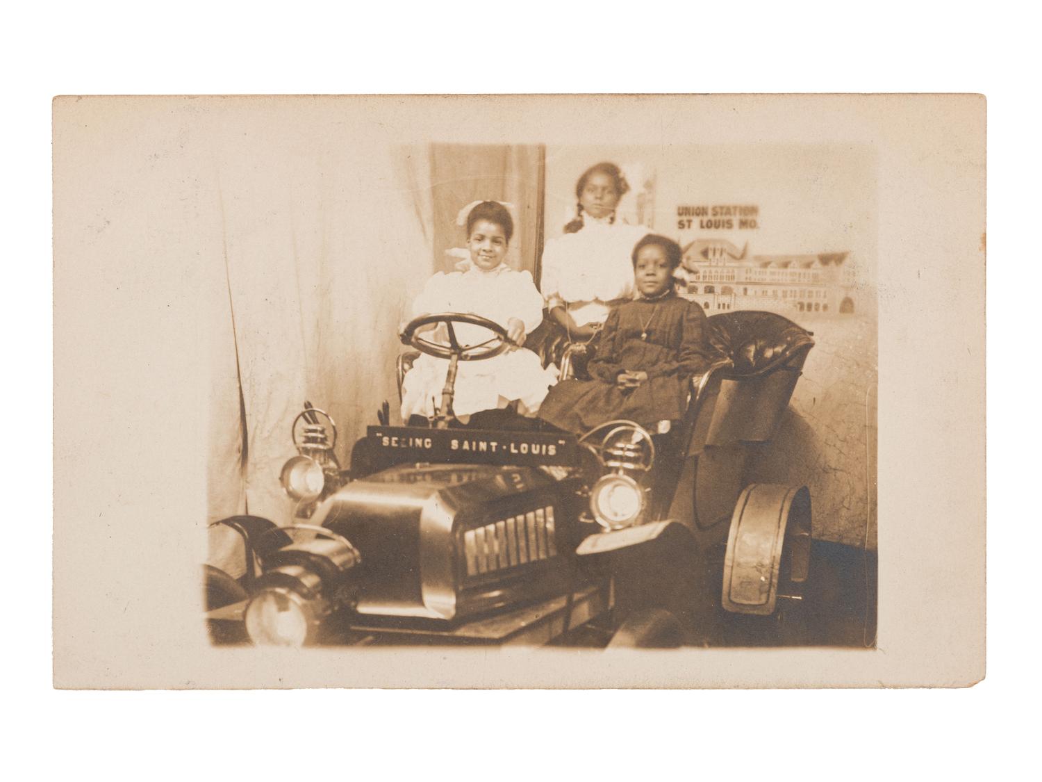 [EARLY PHOTOGRAPHY] Real photo postcard of 3 African American female tourists "Seeing Saint Louis."