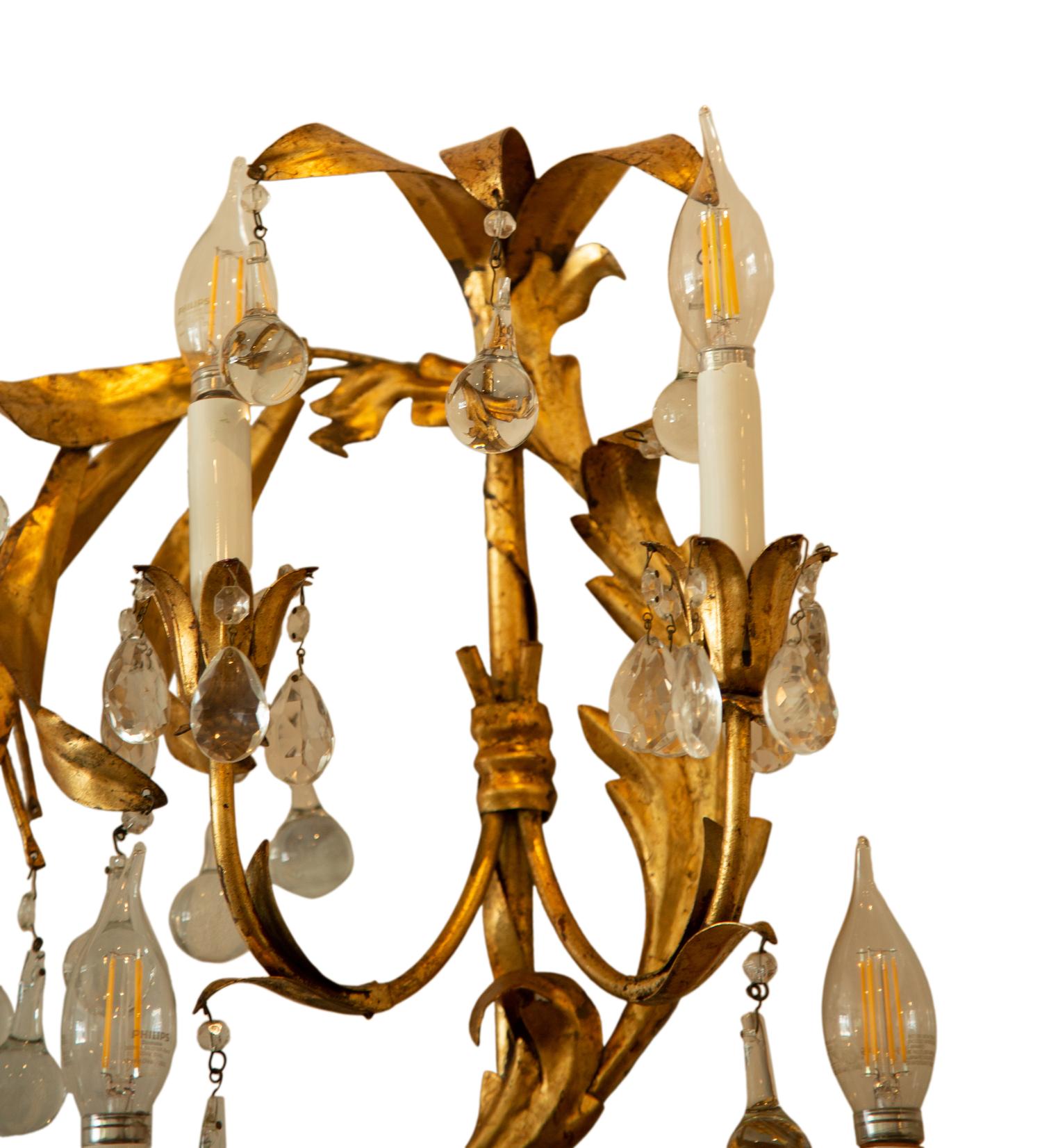 A Pair of Italian Gilt Tole Seven-Light Sconces
