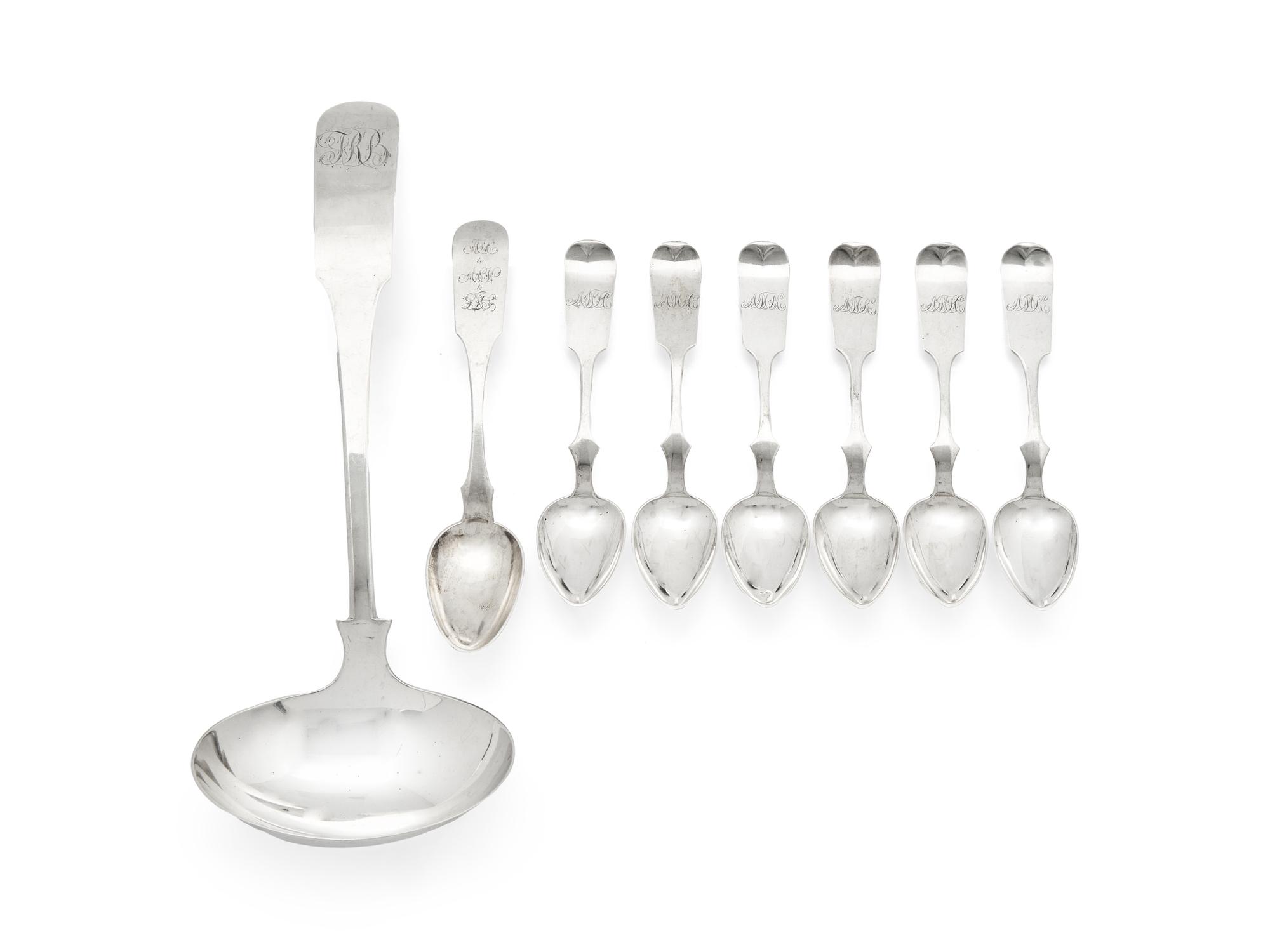 A Group of Eight Coin Silver Fiddle-Back Serving Articles