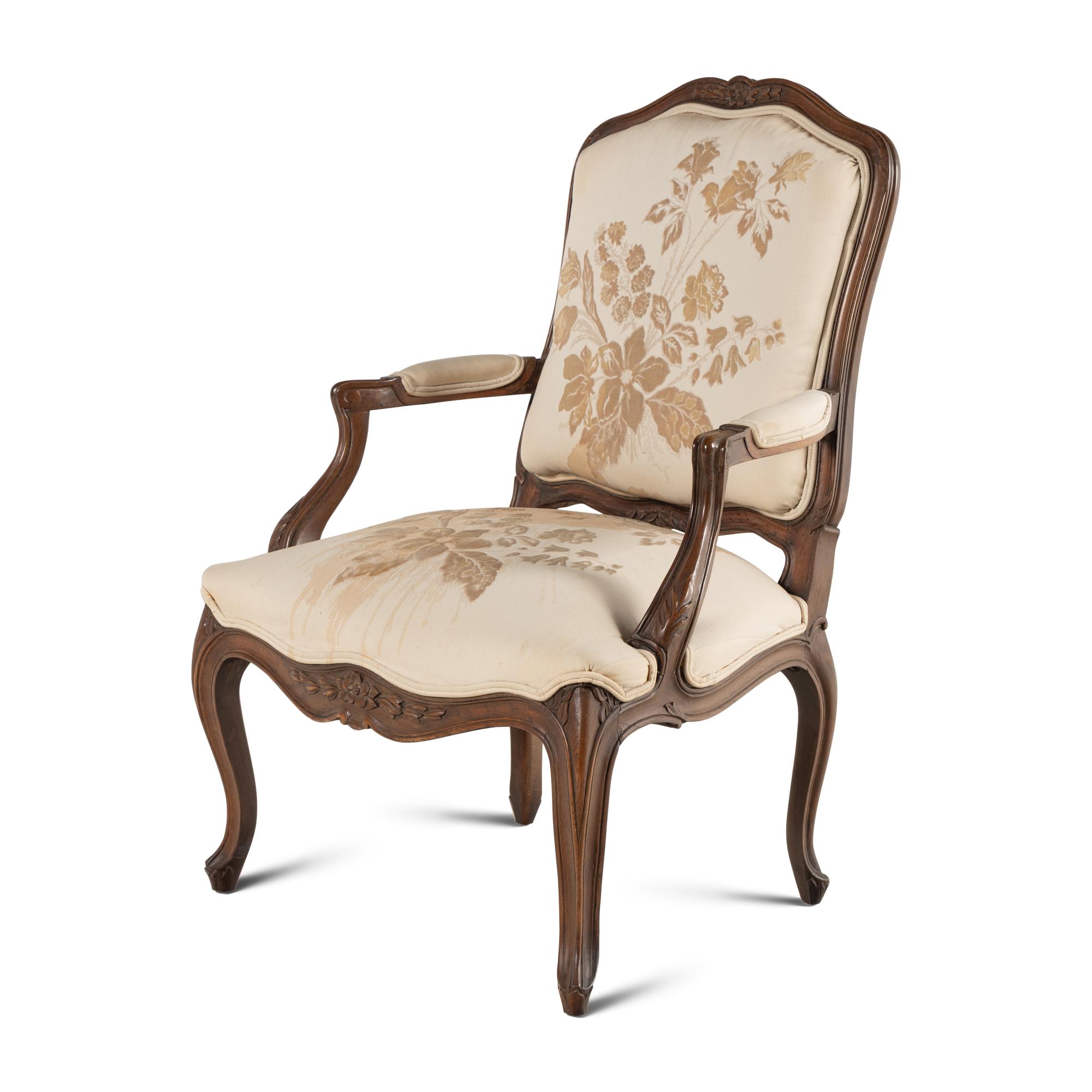 A Louis XV Style Carved Walnut Fauteuil