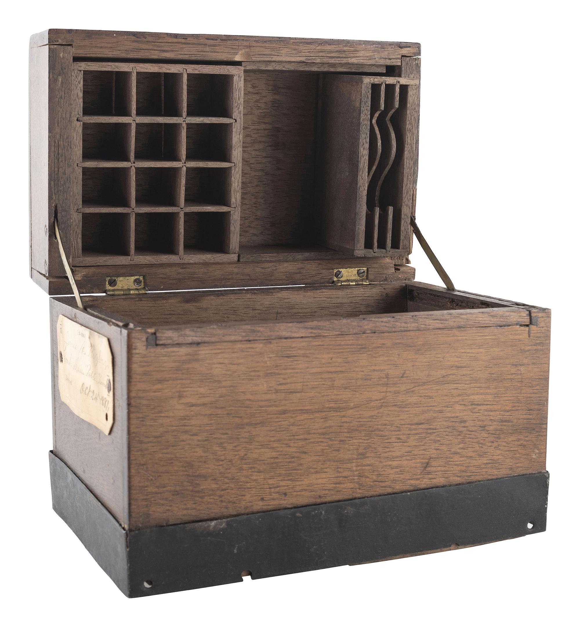 [SCIENCE & TECHNOLOGY]. James A. Rigby patent model for a "Combined Trunk, Desk, Table &c." with original tags, 1882.