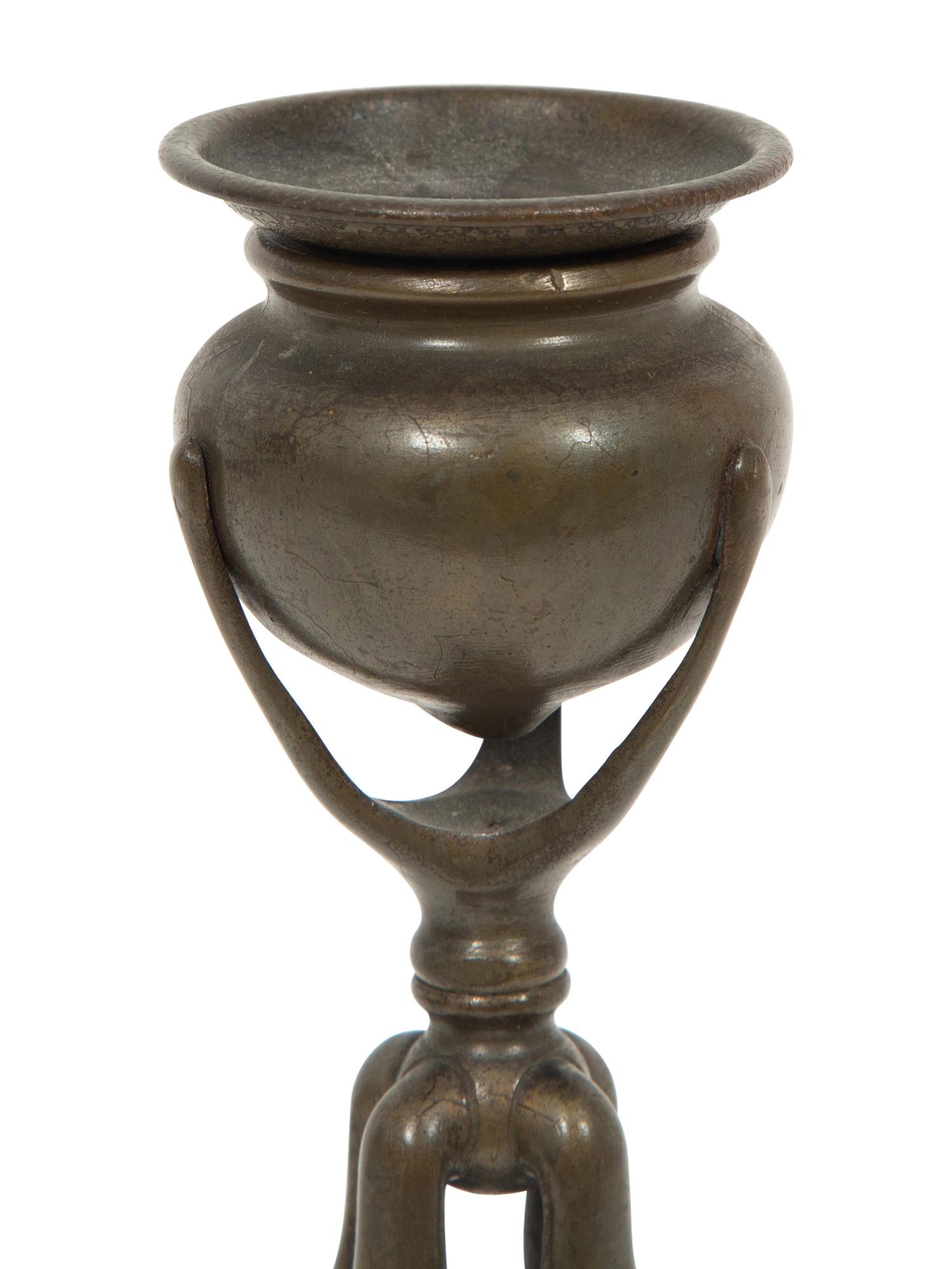 A Tiffany Studios Cat's Paw Bronze Candlestick