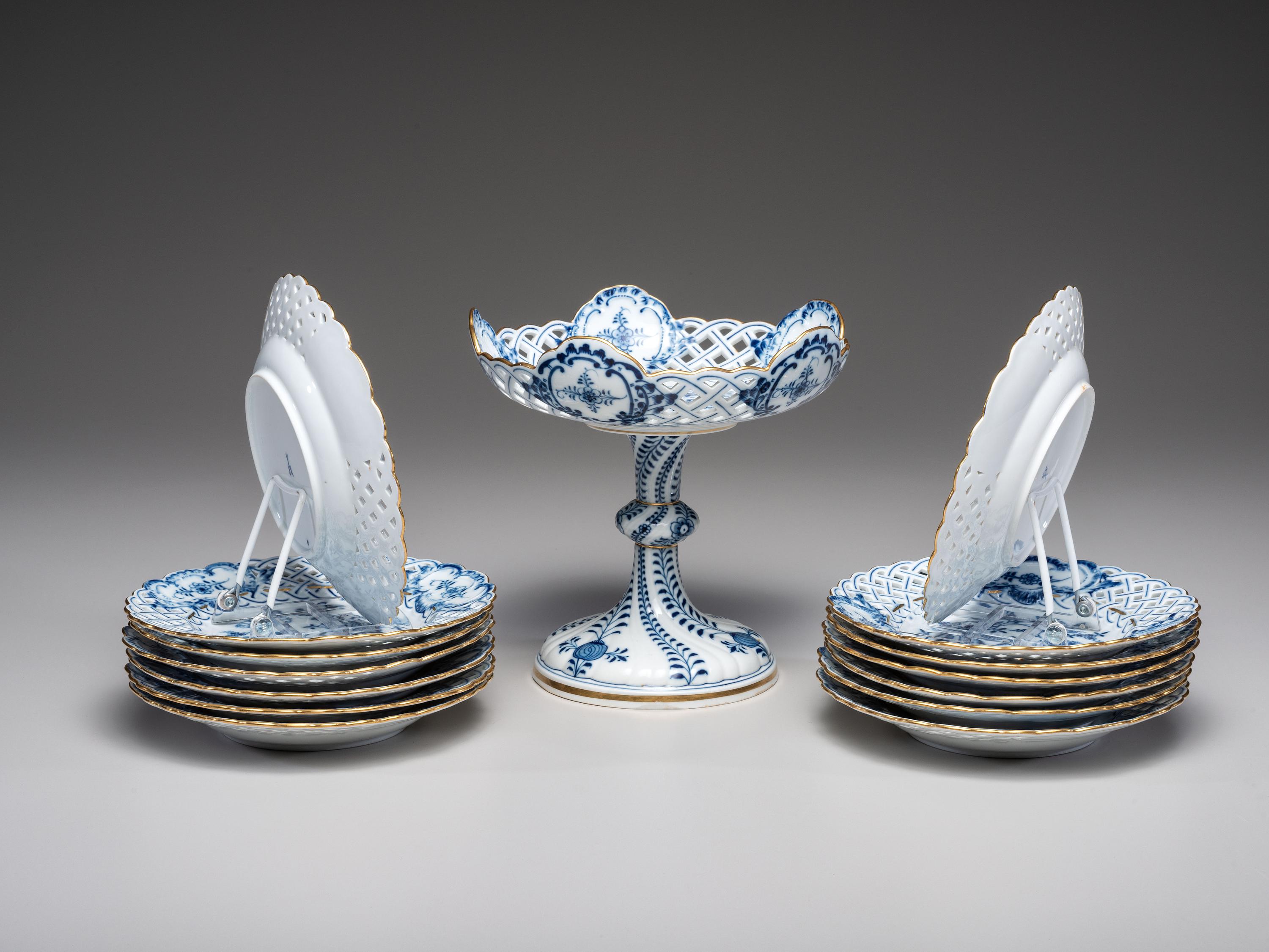 Fourteen Meissen ' Blue Onion' Reticulated Porcelain Plates