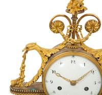 A Louis XVI Gilt Bronze and Marble Mantel Clock