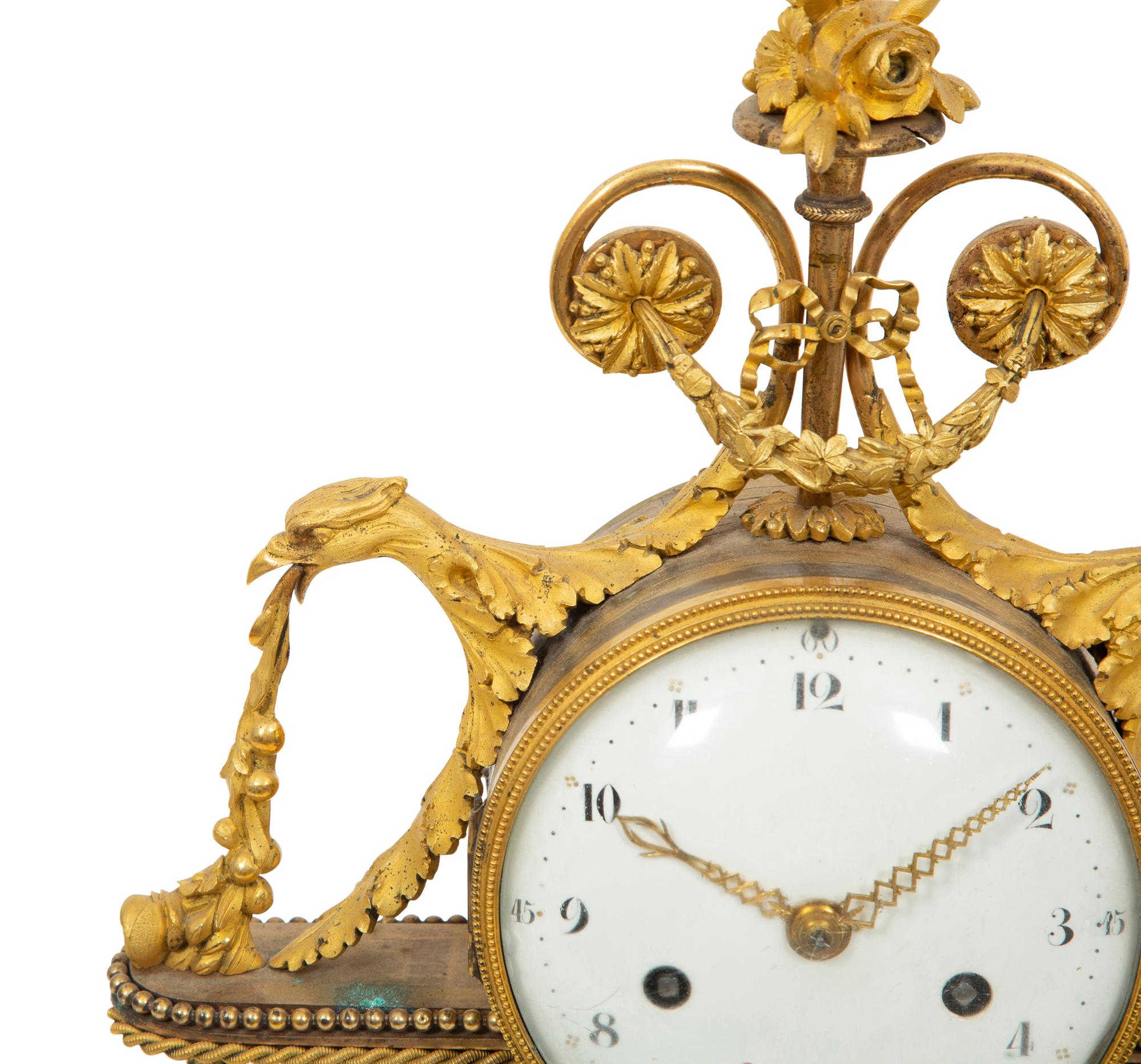 A Louis XVI Gilt Bronze and Marble Mantel Clock