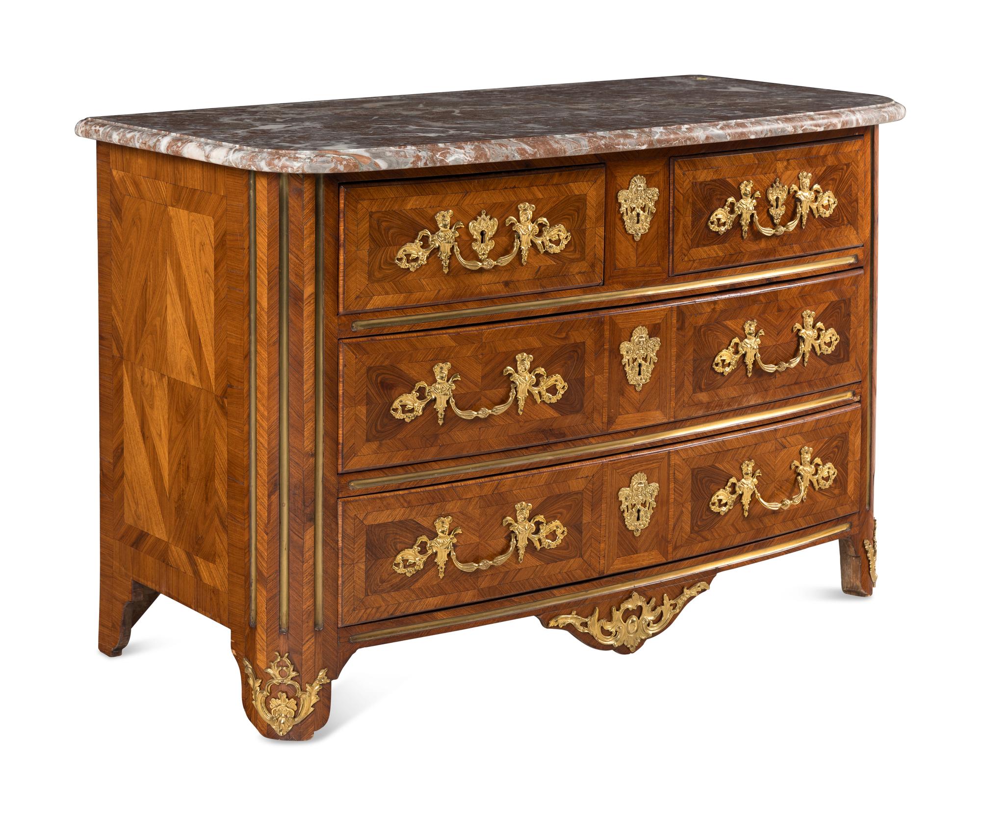 A Régence Gilt Bronze Mounted Walnut Parquetry Commode