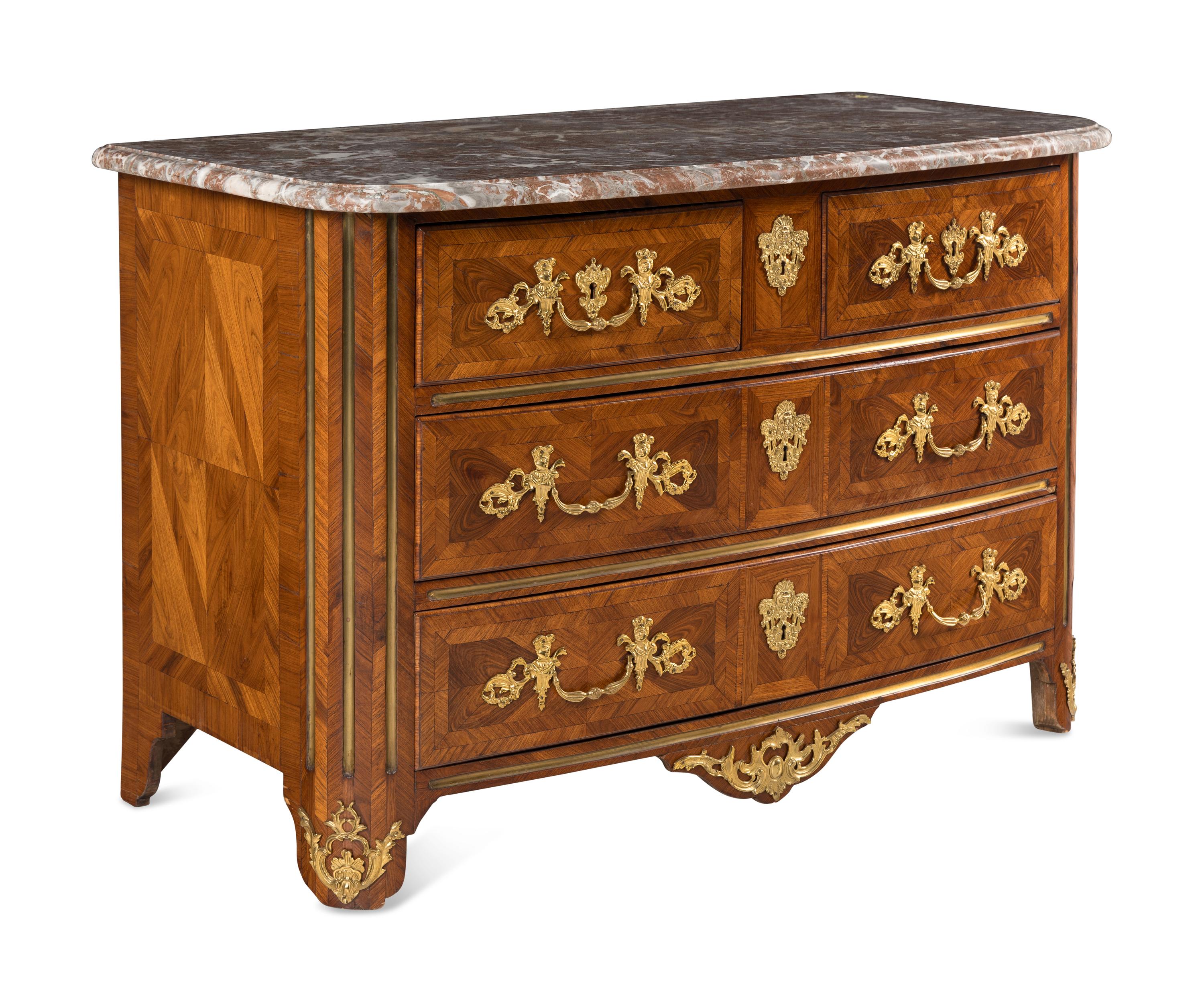 A Régence Gilt Bronze Mounted Walnut Parquetry Commode