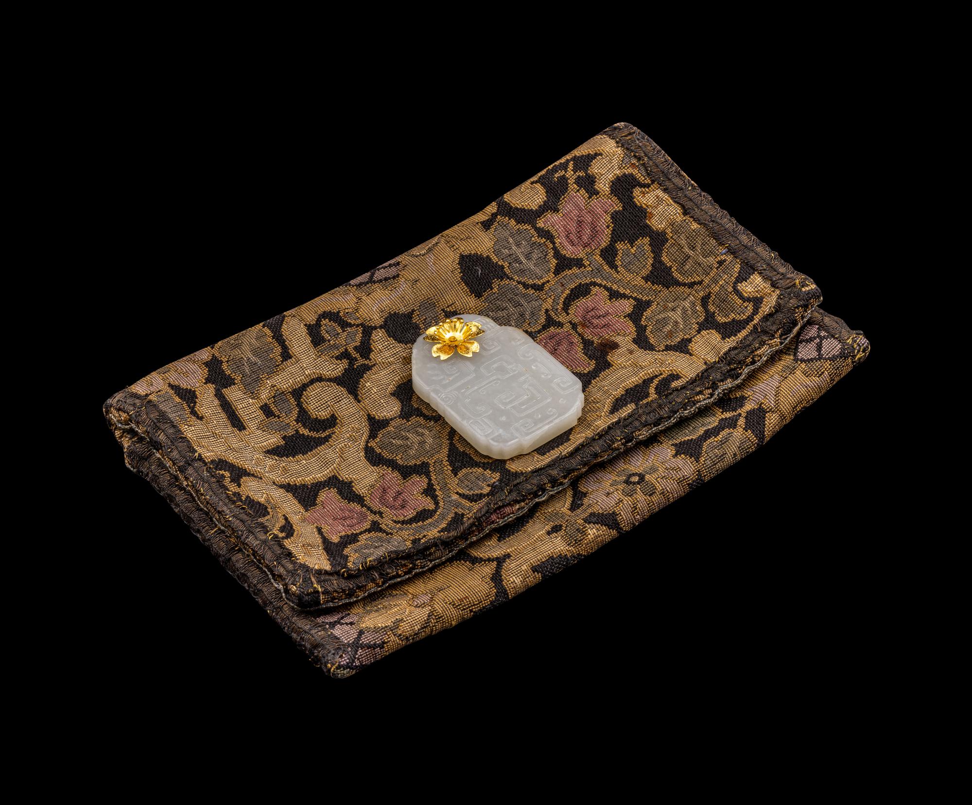A Chinese White Jade 'Kuilong' Plaque