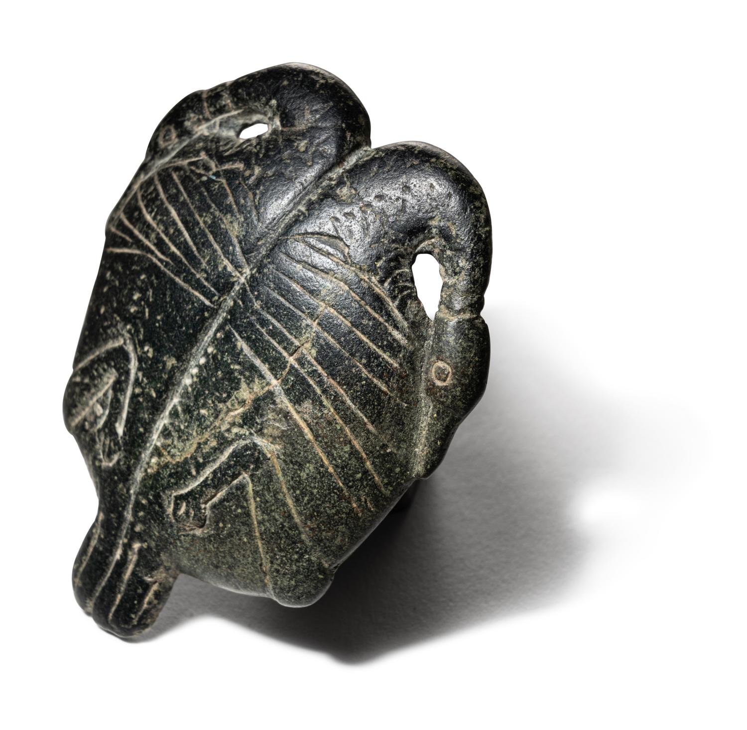 An Egyptian Steatite Cosmetic Palette in the Form of a Double Duck