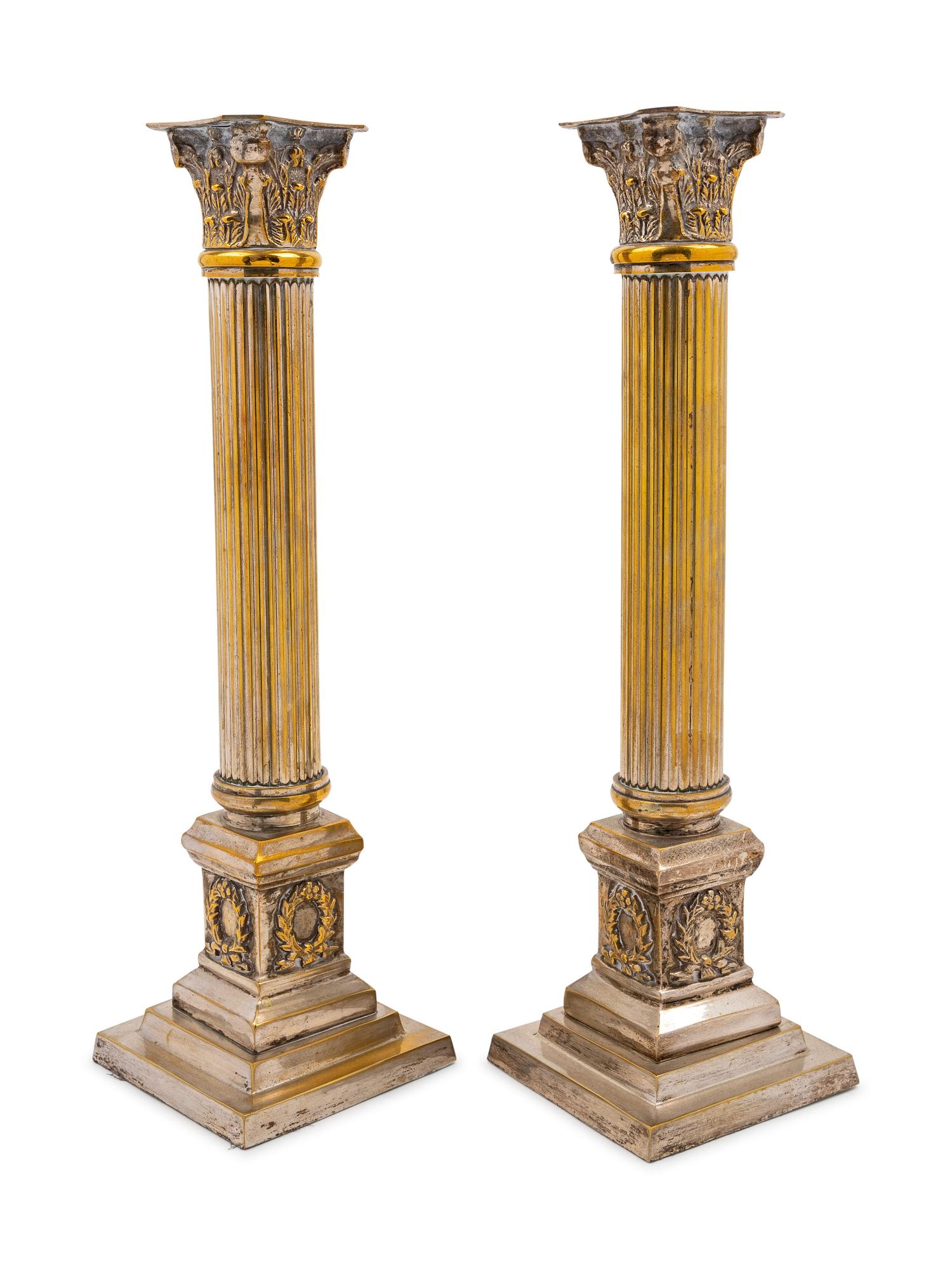 A Pair of Silvered Metal Candlesticks