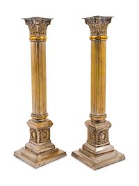 A Pair of Silvered Metal Candlesticks