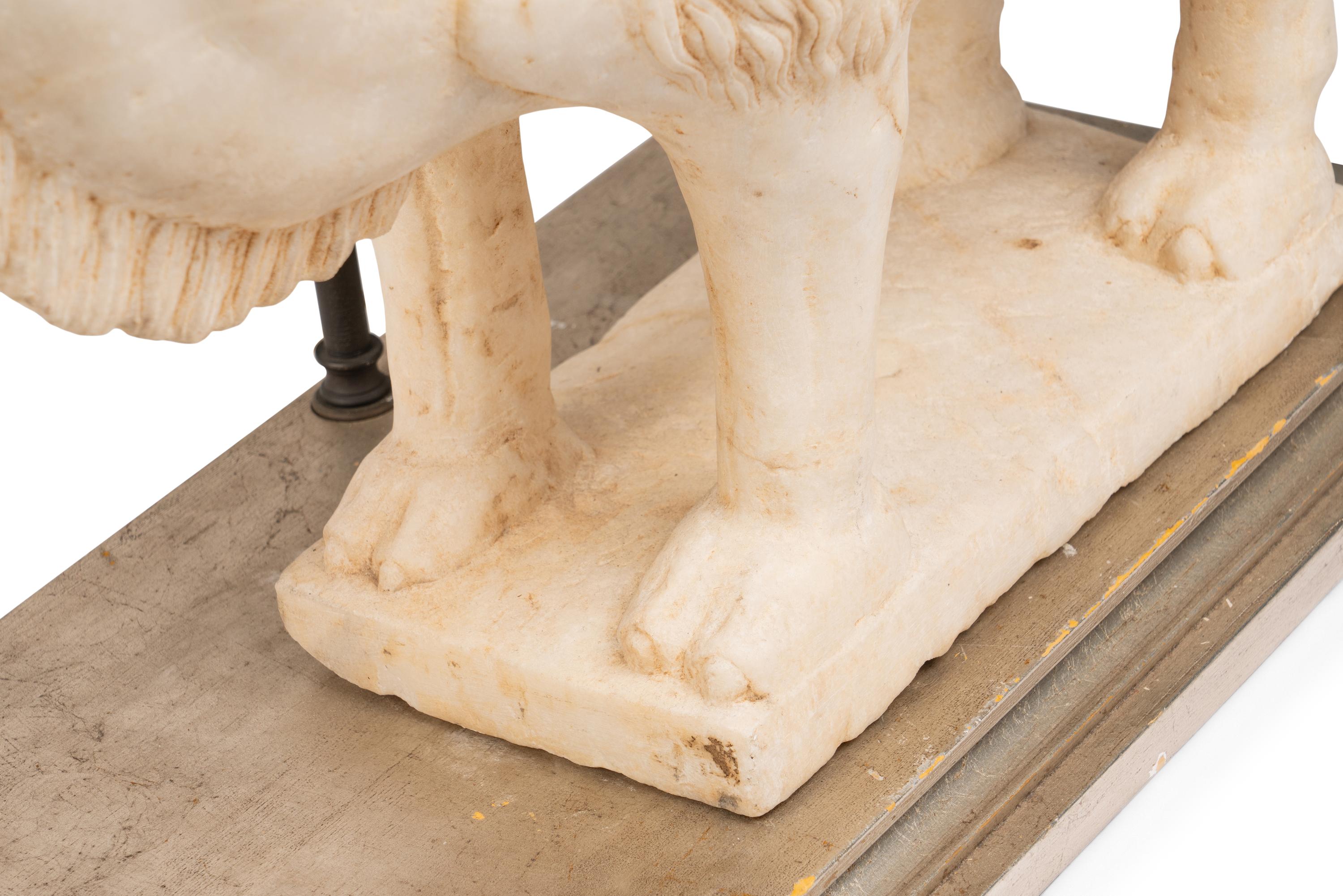 A Pair of Carved Marble Camels