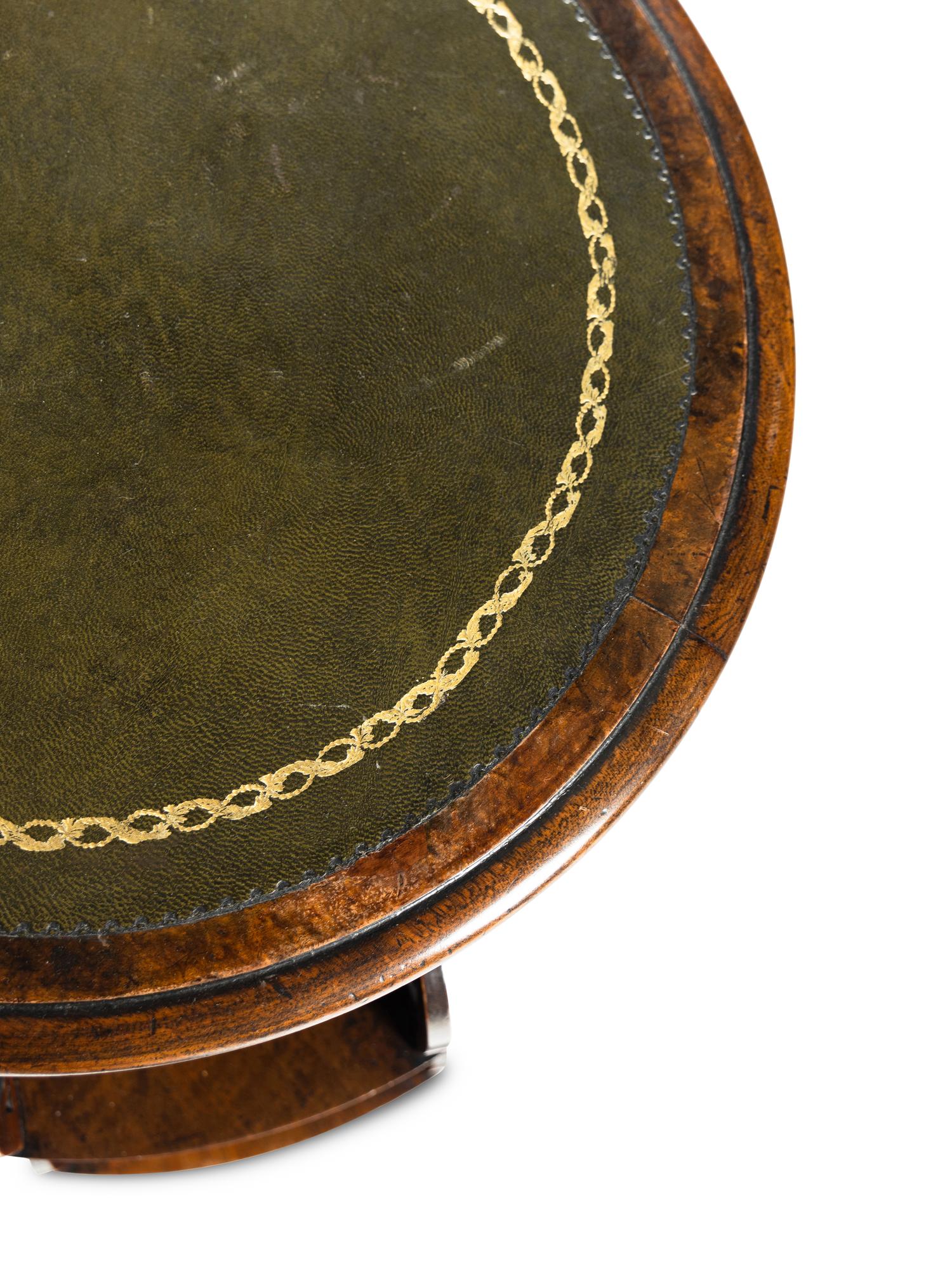 A William IV Mahogany Revolving Book Stand with Candle Branch