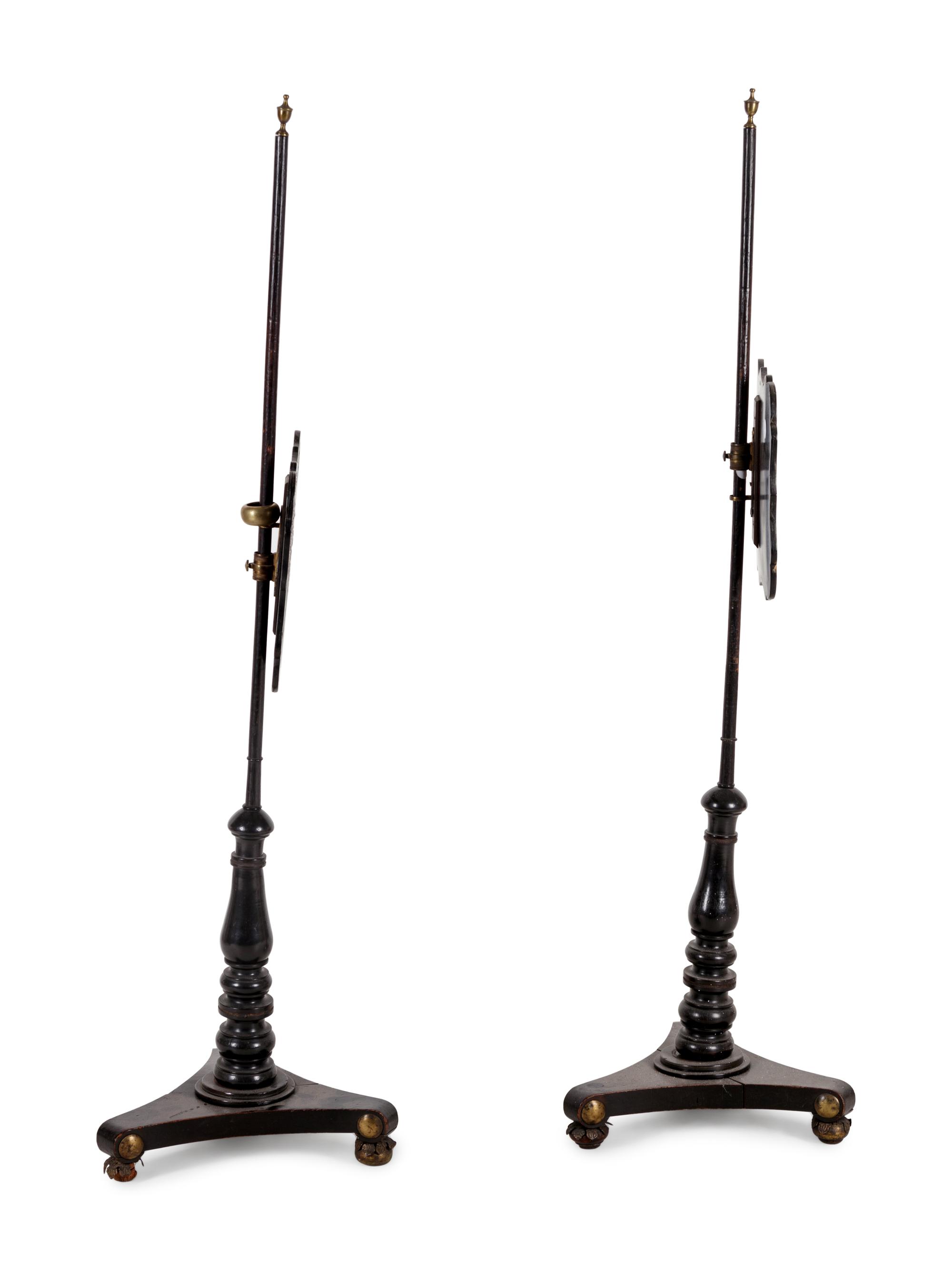 A Pair of Regency Black Lacquered and Chinoiserie Decorated Pole Screens