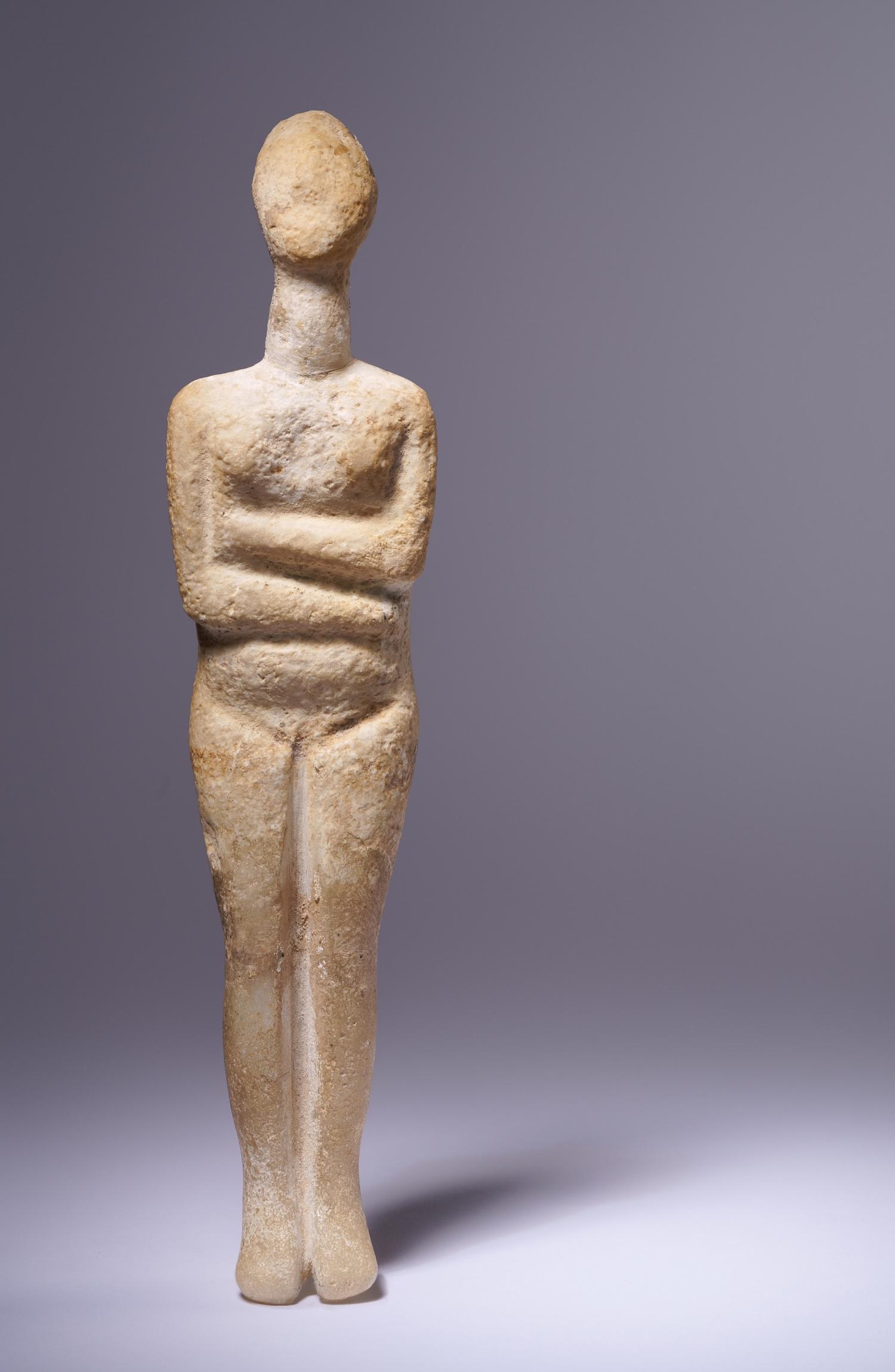 A Cycladic Marble Reclining Female Figure
