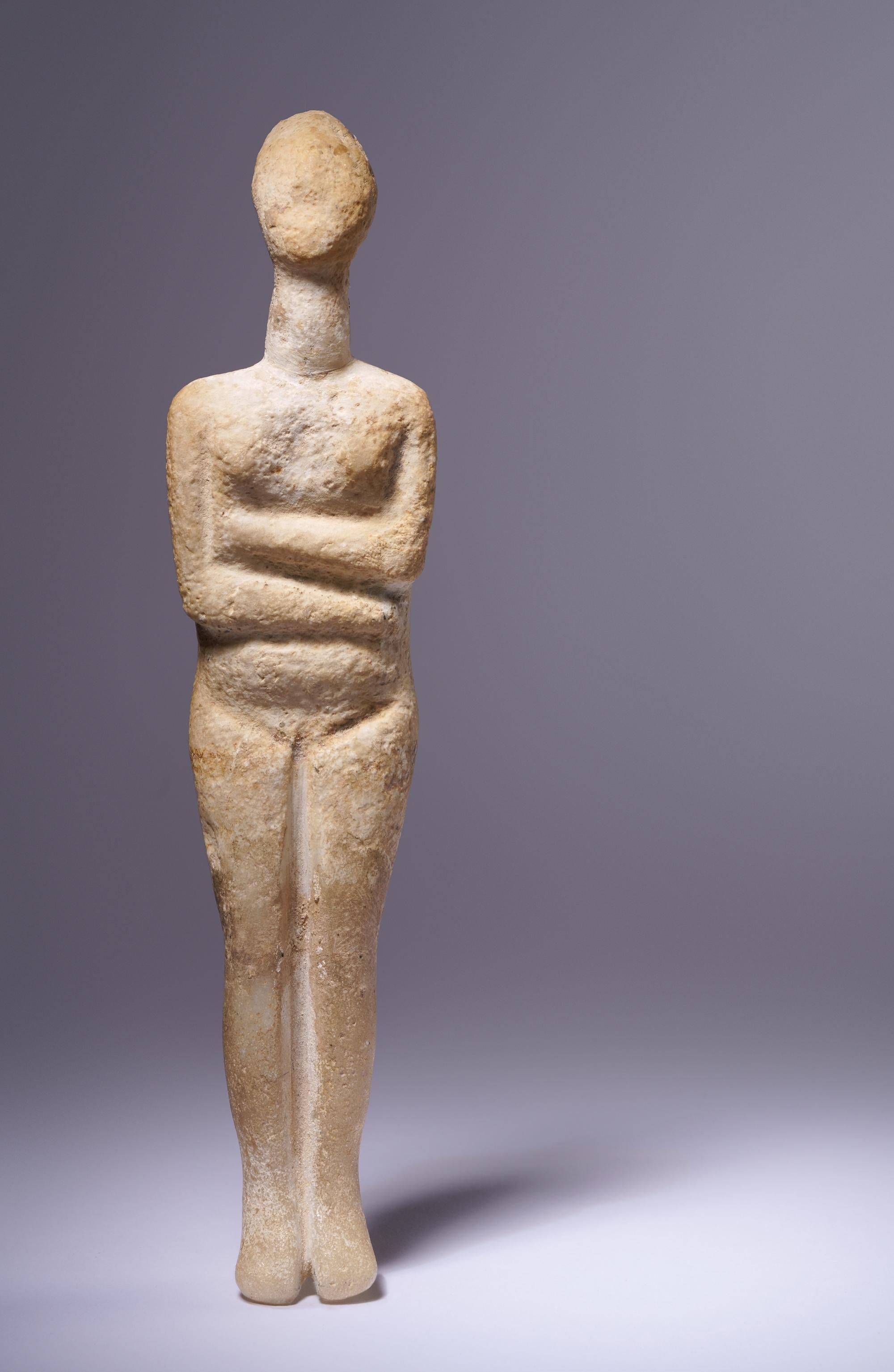 A Cycladic Marble Reclining Female Figure