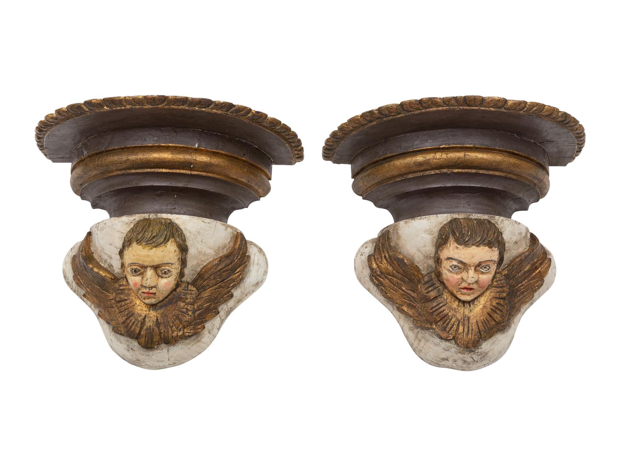 A Pair of Continental Baroque Style Polychromed Putto Mask Wall Brackets