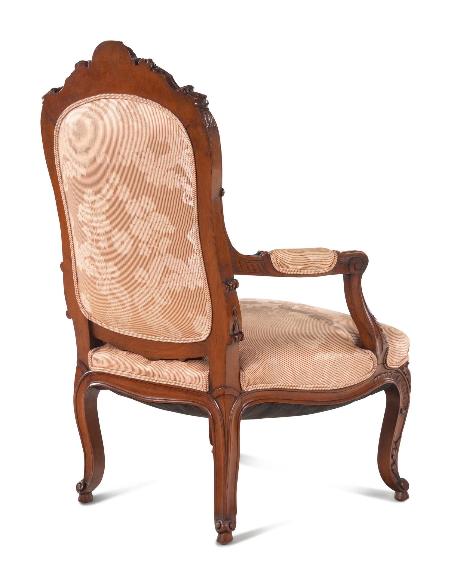 A Louis XV Style Carved Walnut Fauteuil
