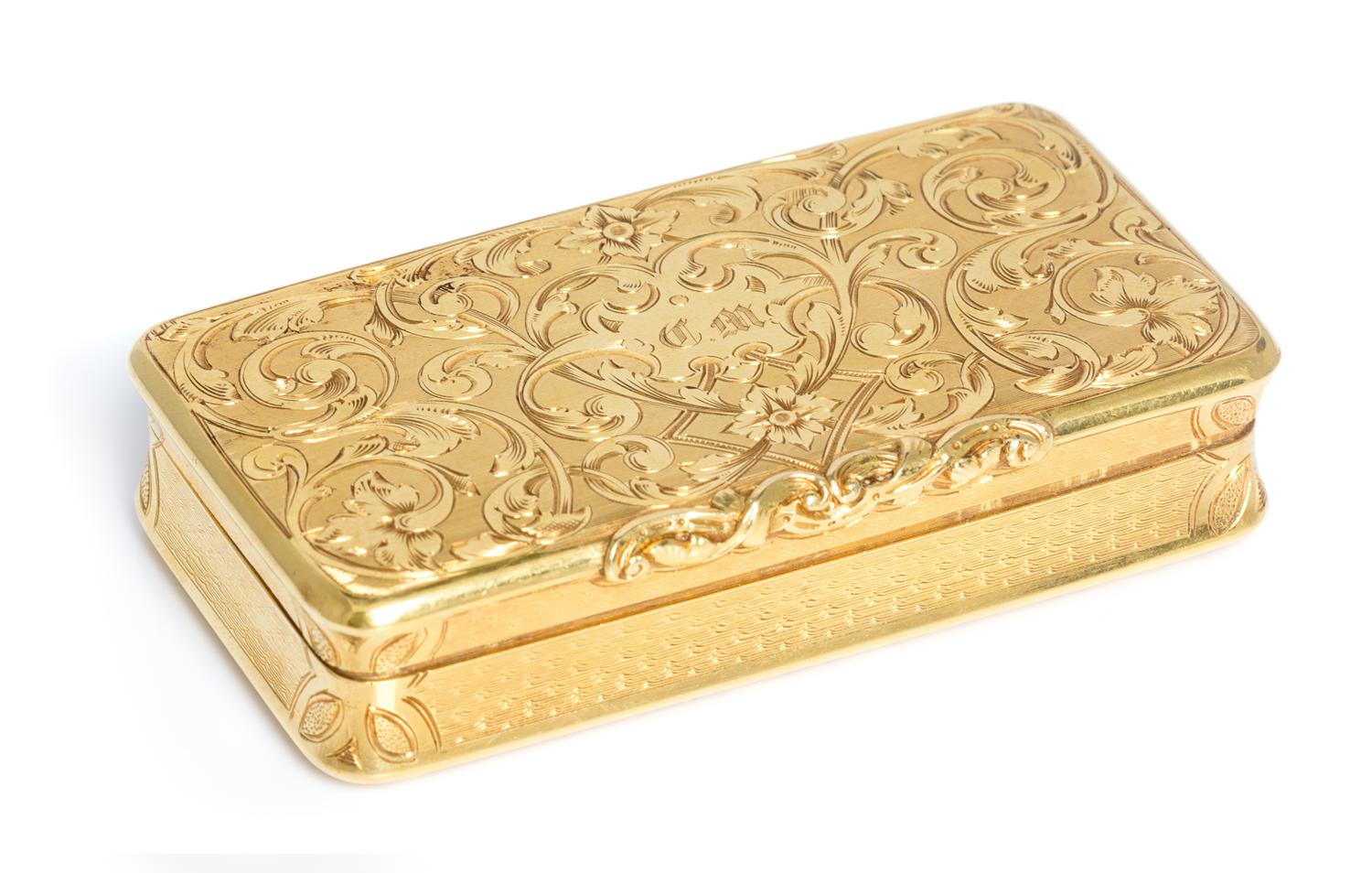 A French 18 Karat Gold Snuff Box, Possibly Louis Tassin, Paris, the lid worked with foliate volute and floral elements and centered by