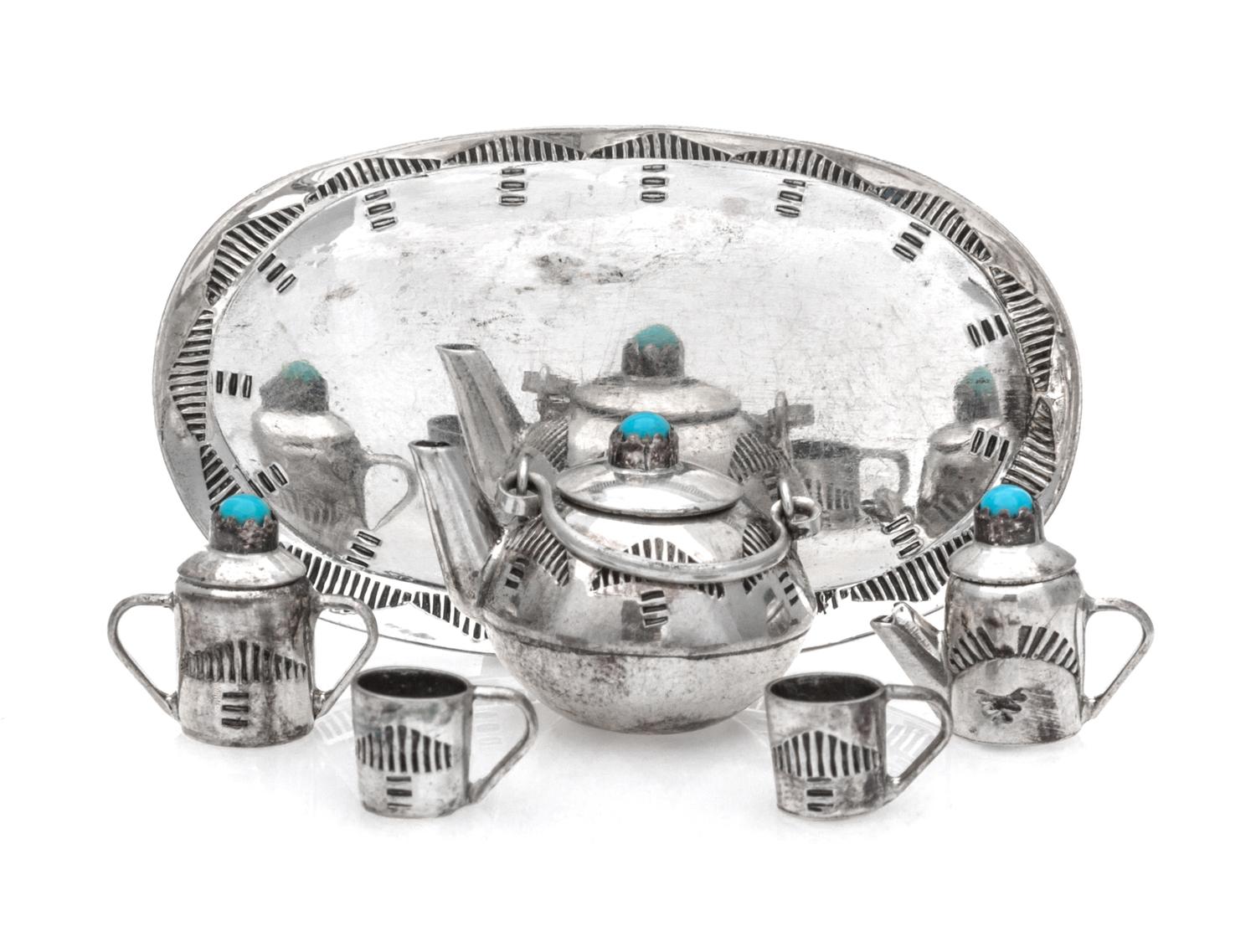 A Native American Silver Six-Piece Tea Service, Elizabeth Whitman, Navajo, comprising a teapot, a creamer, a covered sugar, a tray and