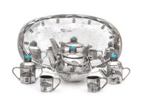 A Native American Silver Six-Piece Tea Service, Elizabeth Whitman, Navajo, comprising a teapot, a creamer, a covered sugar, a tray and
