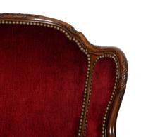 A Pair of Louis XV Style Walnut Bergères