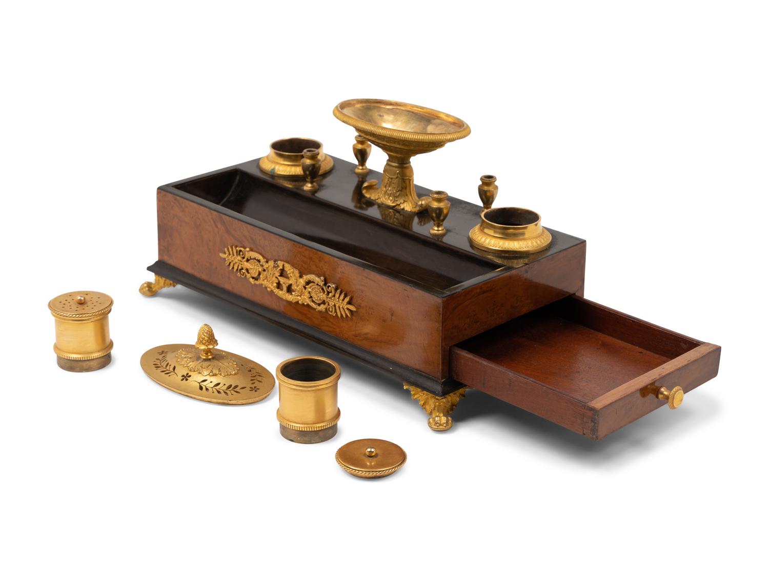 A French Gilt Bronze and Parcel Ebonized Burlwood Encrier