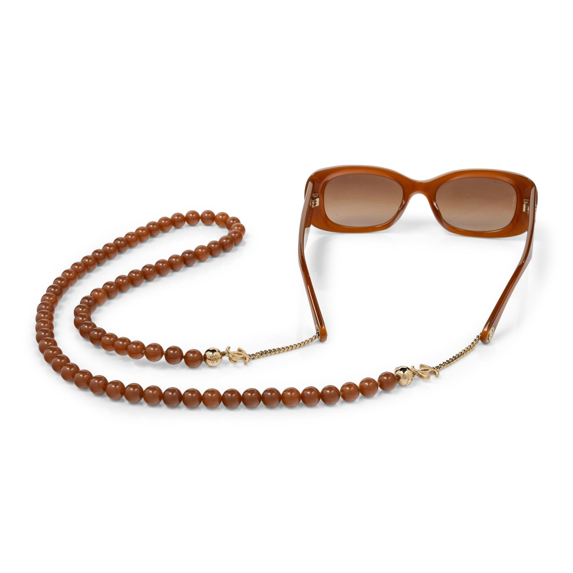 CHANEL, SUNGLASSES & BEADED CHAIN