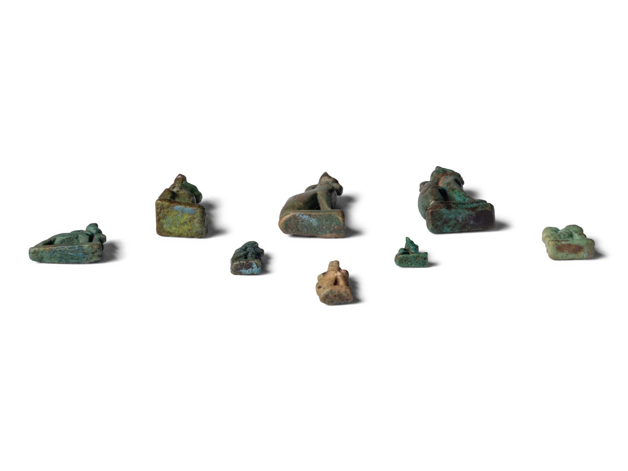Eight Egyptian Faience Bastet Amulets