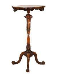 An Italian Rococo Carved Walnut Tripod Stand