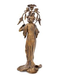 An Art Nouveau Gilt Bronze Figural Candlestick