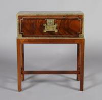 An English Brass Mounted Trunk Table, Height of box 7 1/2 x width 20 3/4 x depth 11 1/8 inches.
