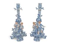A Pair of German Porcelain Figural Candlesticks — CIRCA 1900