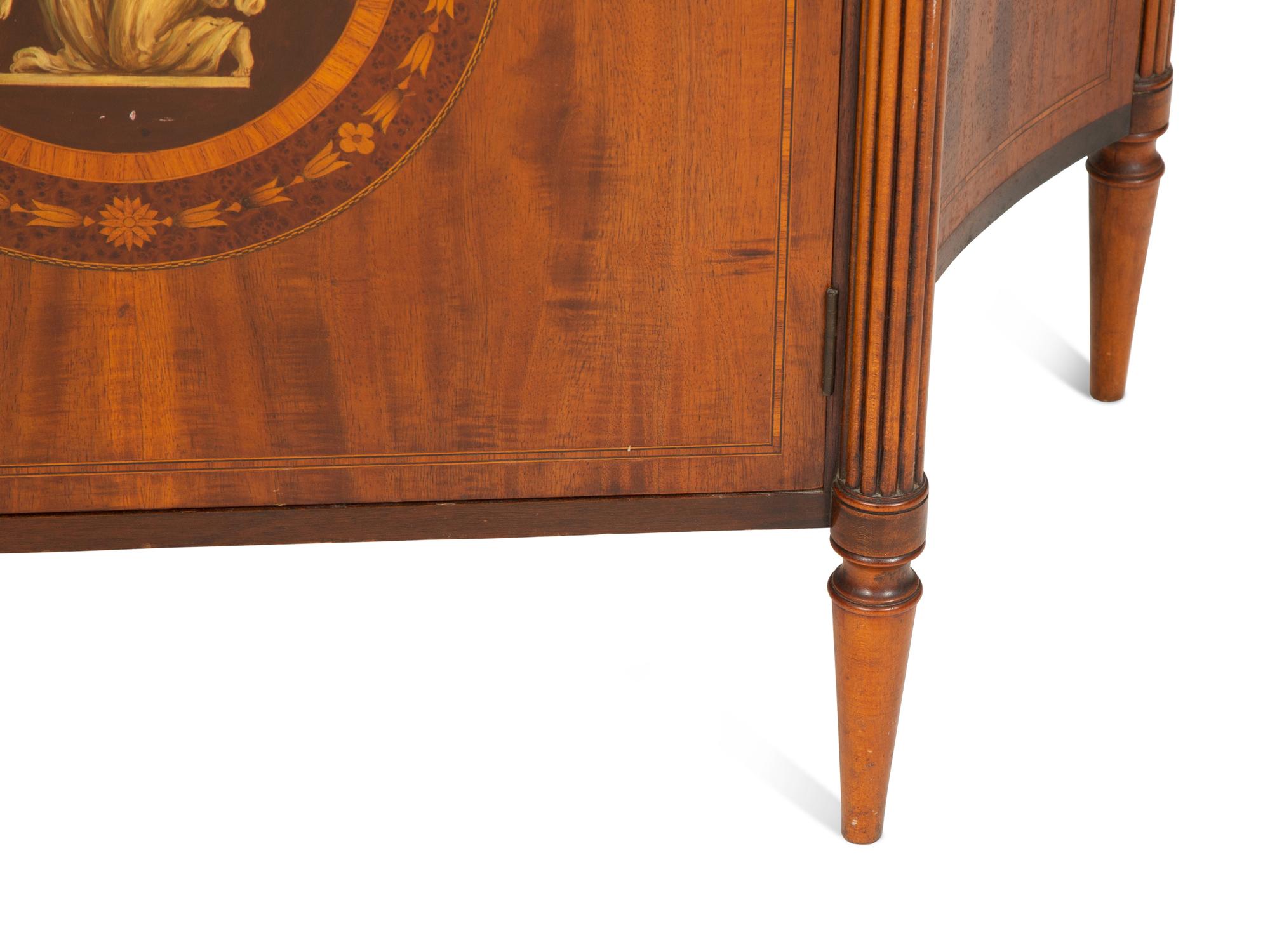 A Joseph Gerte Mahogany and Marquetry Commode