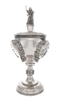 An American Silver Covered Trophy, Juergens & Andersen, Chicago, IL, Late 19th Century, of baluster form with a figural finial, the bod