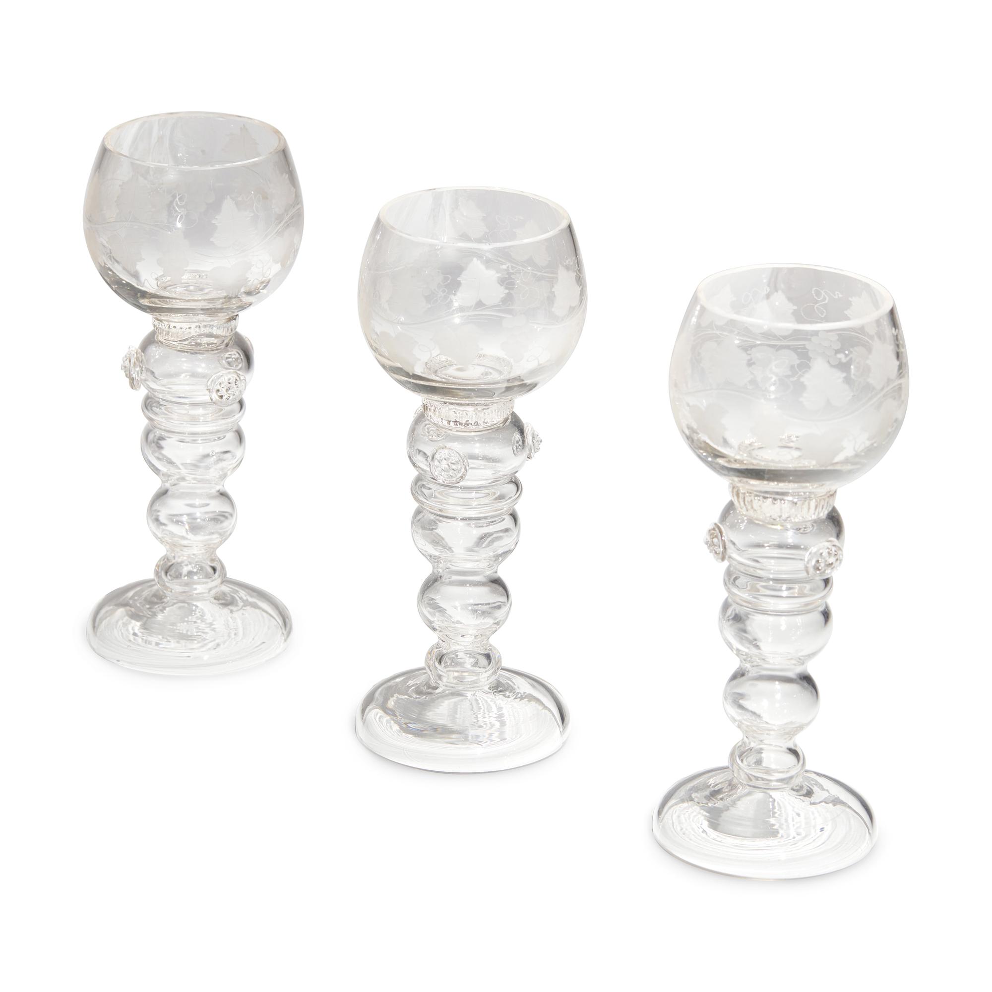 A Set of Eight Blown and Etched Glass Wine Glasses