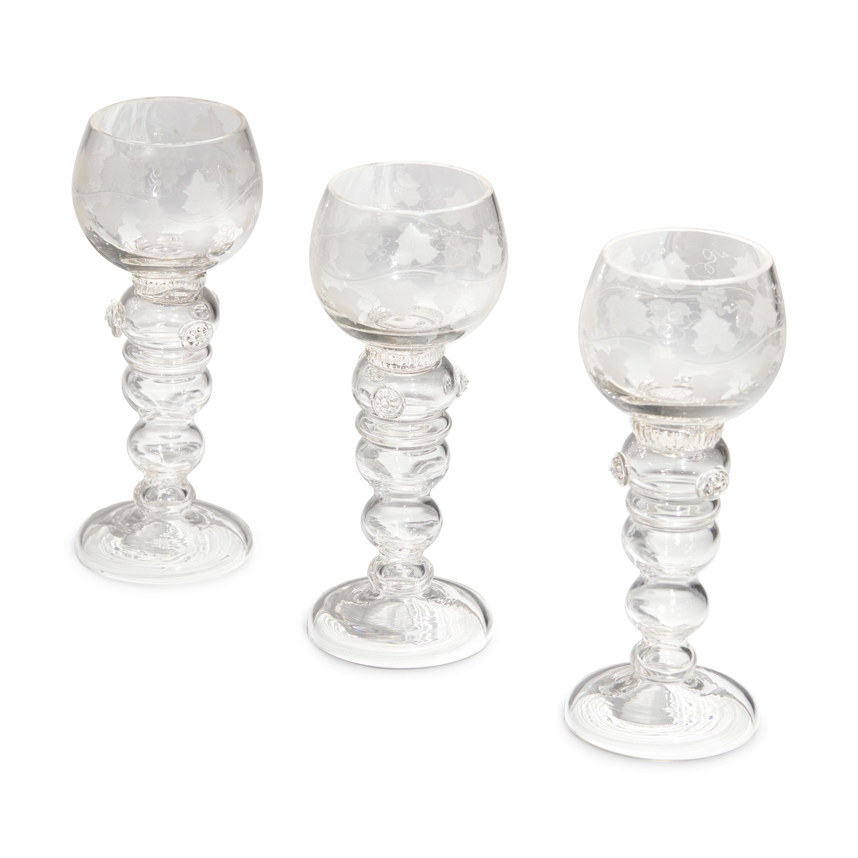 A Set of Eight Blown and Etched Glass Wine Glasses
