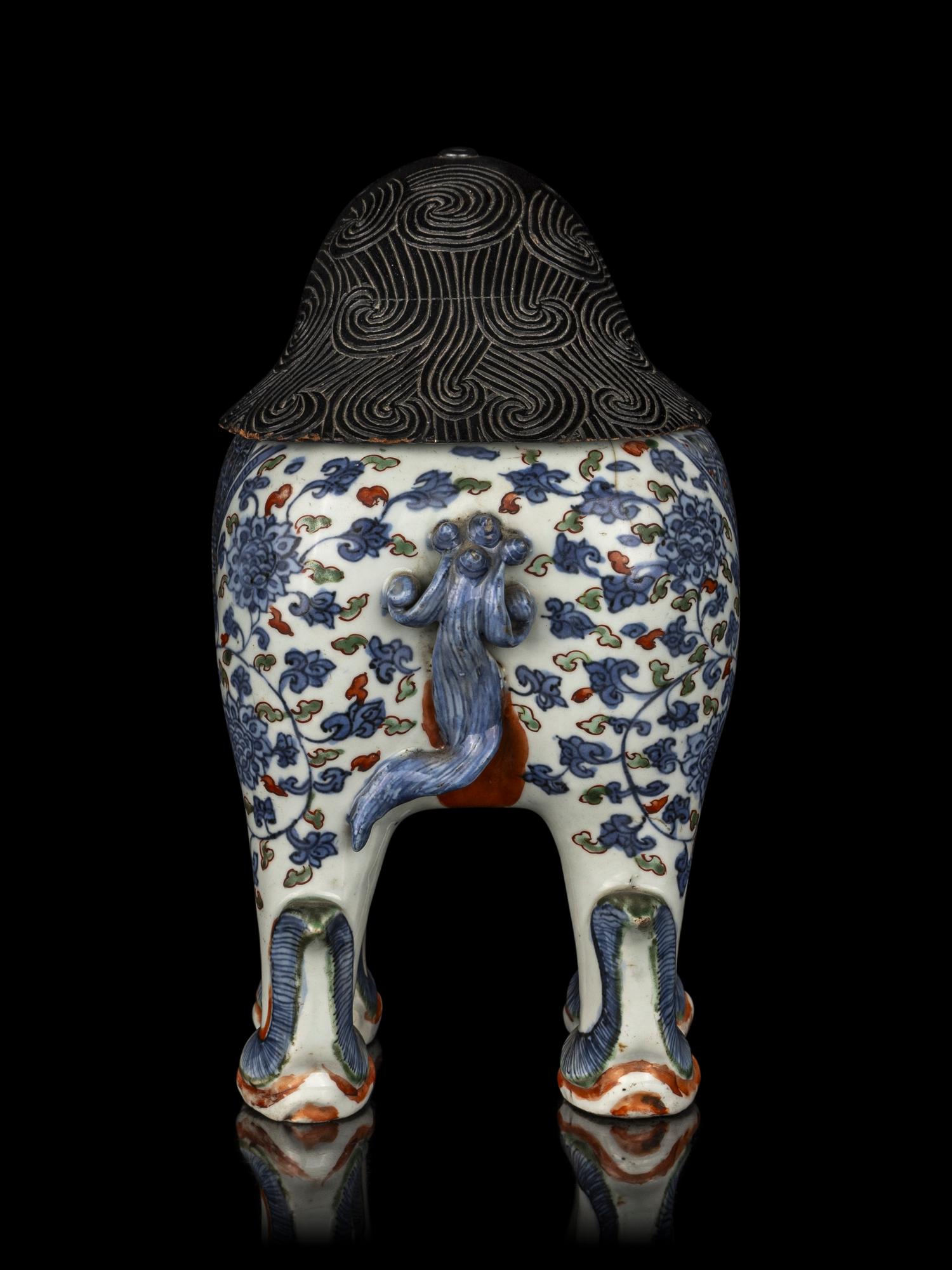 A Chinese Copper Red and Underglaze Blue Porcelain Mythical-Beast Form Incense Burner