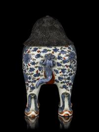 A Chinese Copper Red and Underglaze Blue Porcelain Mythical-Beast Form Incense Burner