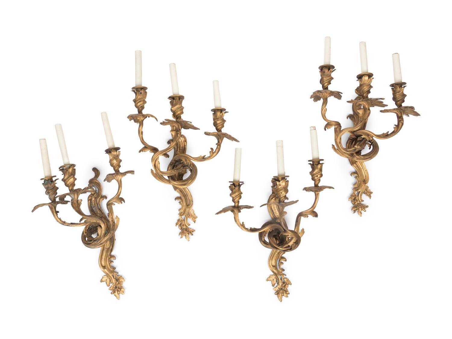 A Set of Four Louis XV Style Gilt Bronze Three-Light Sconces