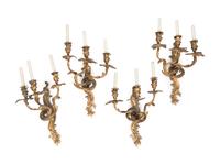 A Set of Four Louis XV Style Gilt Bronze Three-Light Sconces