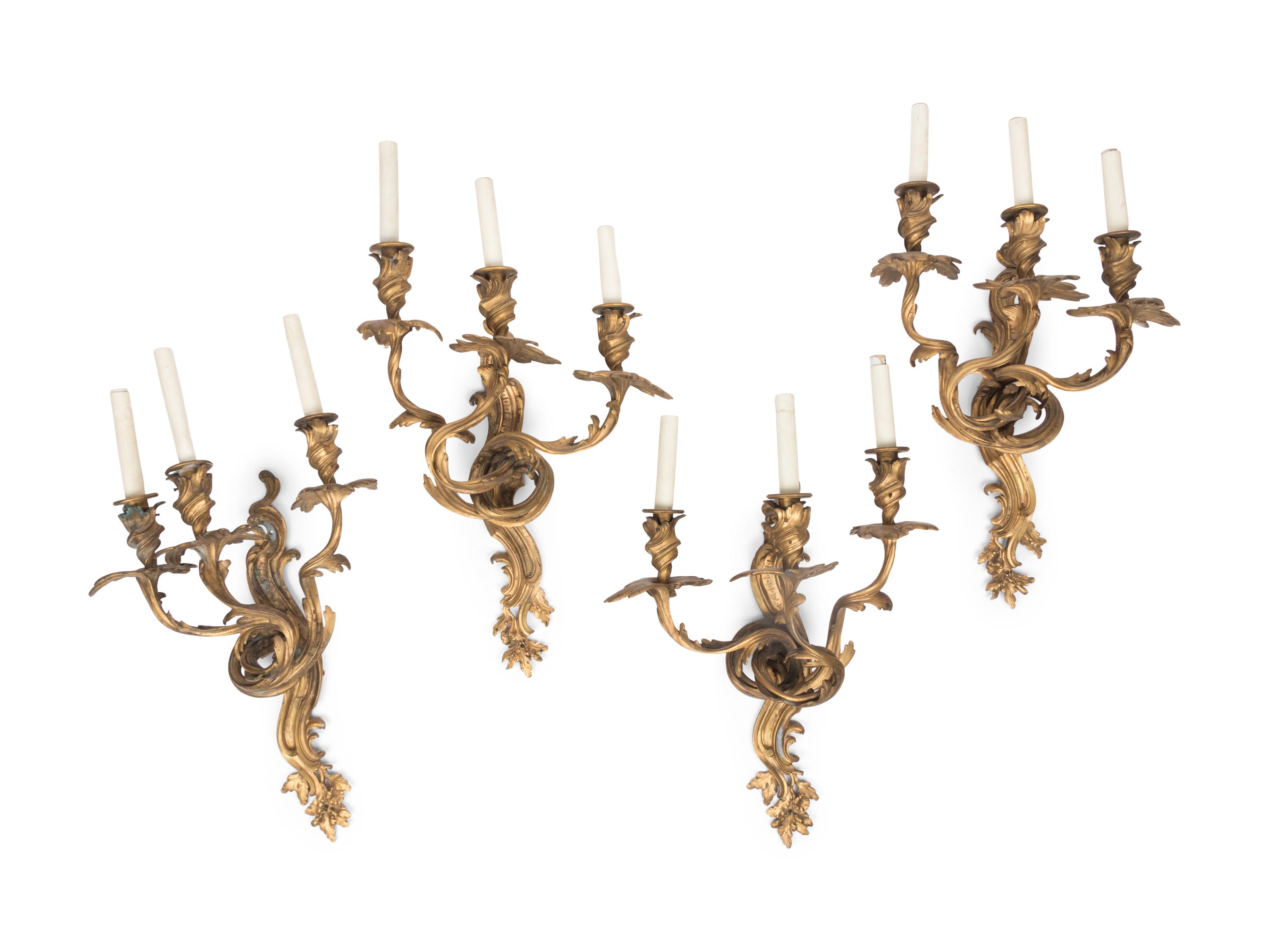 A Set of Four Louis XV Style Gilt Bronze Three-Light Sconces
