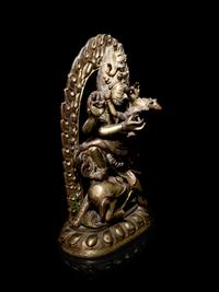 A Tibetan Gilt Bronze Figure of Mahakala and Consort