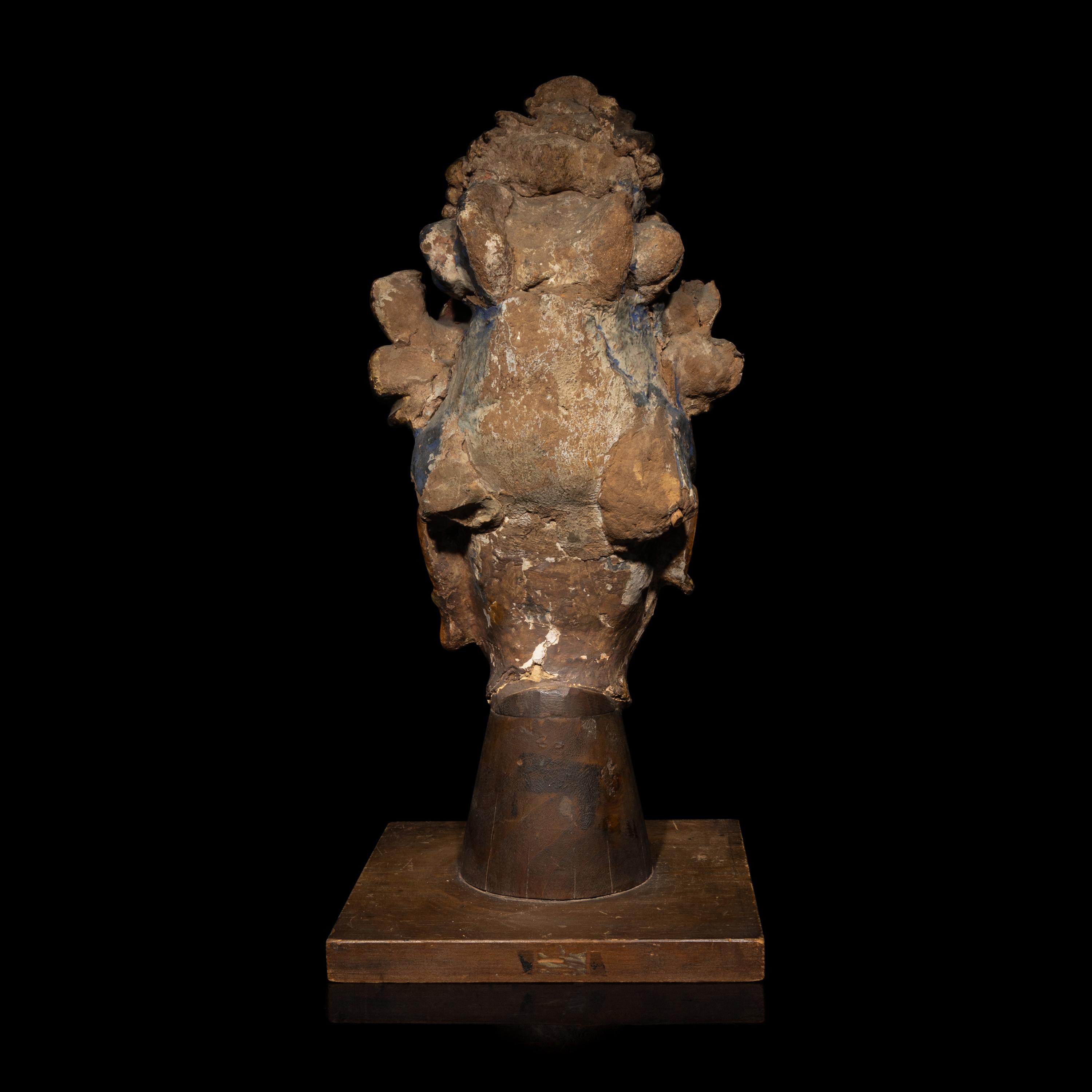 A Chinese Polychrome Painted Stucco Head of a Female Attendant, Song-Ming Dynasty 宋-明 彩繪泥塑侍女頭像