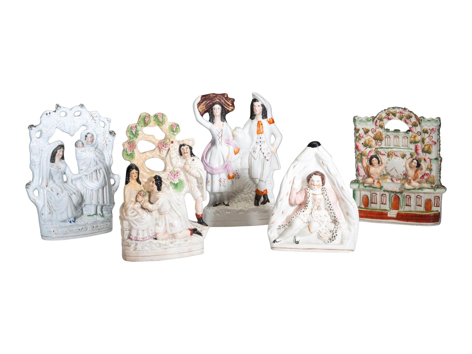 Four Staffordshire Glazed Figures and a Figural Spill Vase