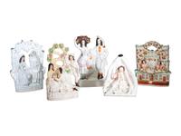 Four Staffordshire Glazed Figures and a Figural Spill Vase