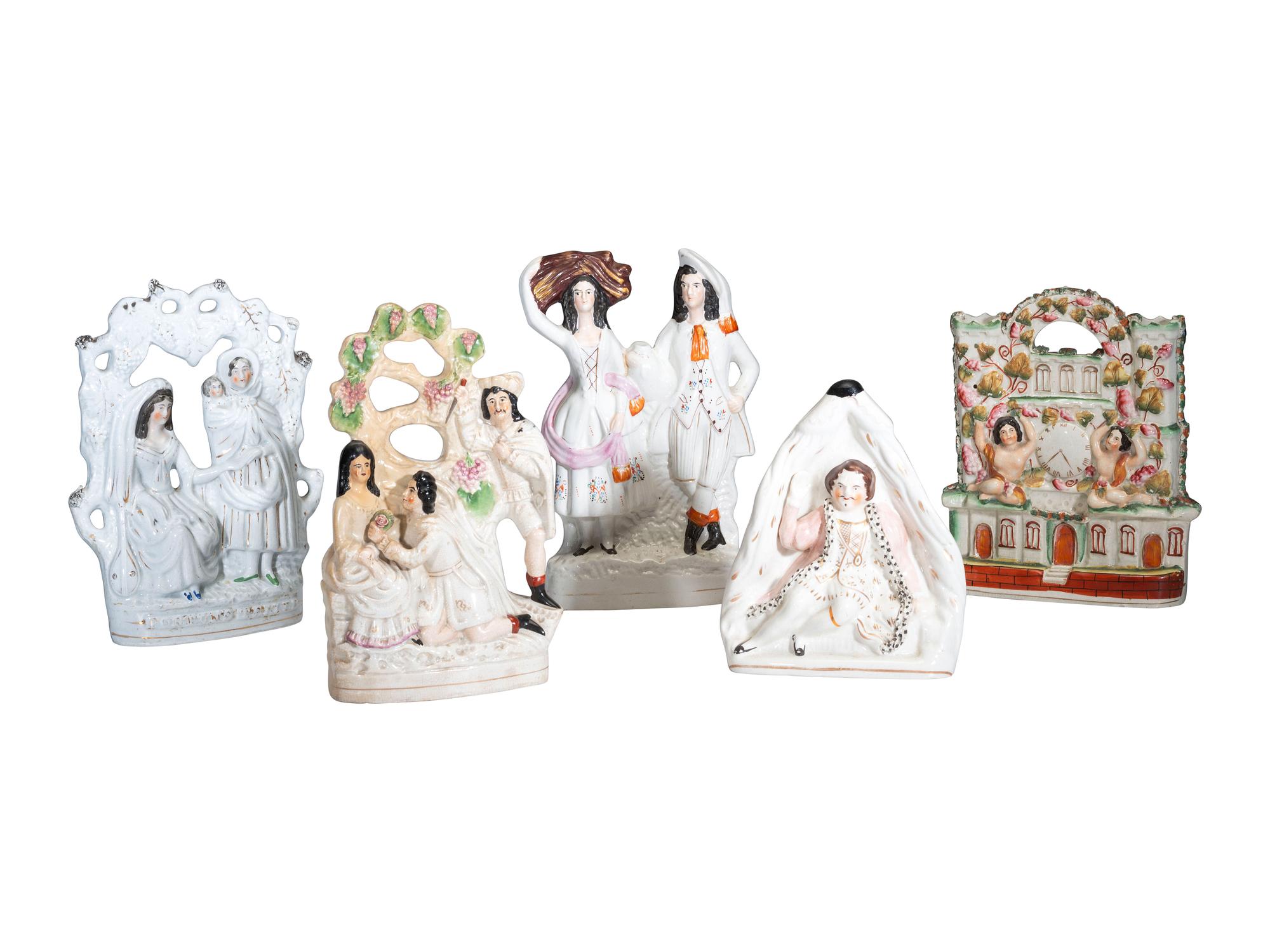 Four Staffordshire Glazed Figures and a Figural Spill Vase