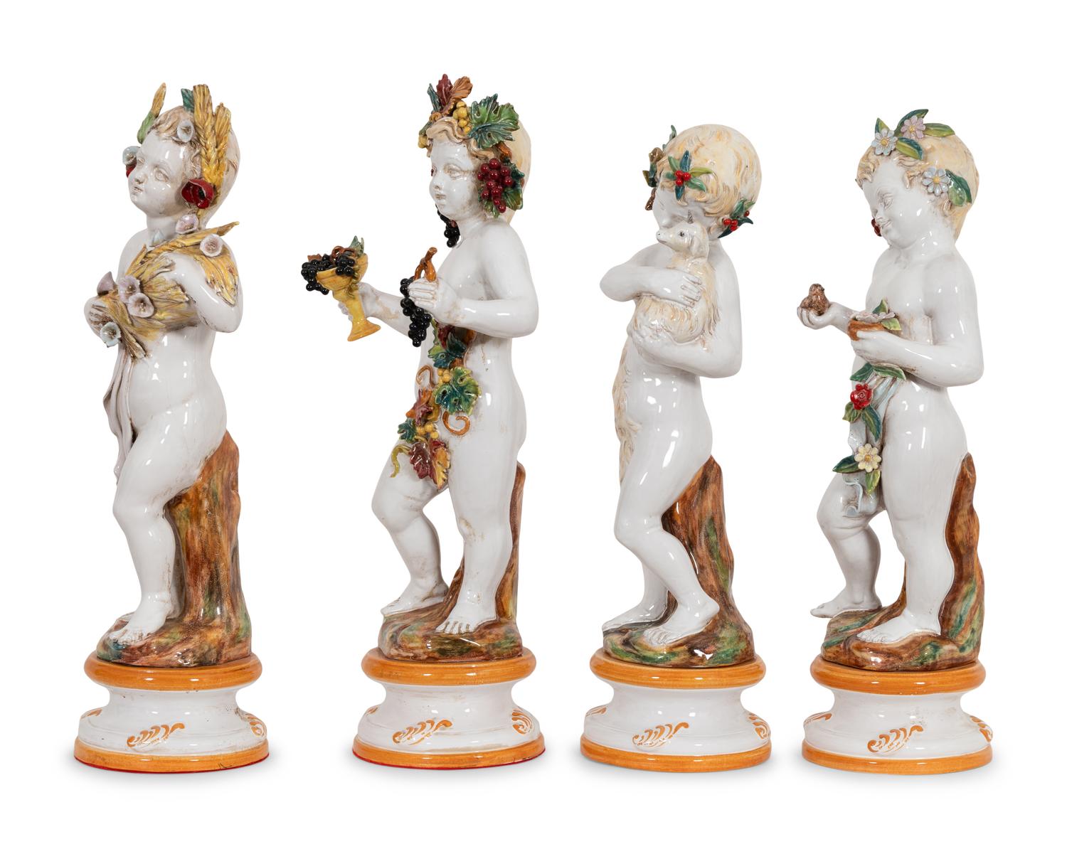 A Set of Large Italian Majolica Four Seasons Putti Figures