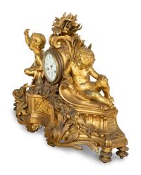 A Napoleon III Gilt Bronze Mantel Clock